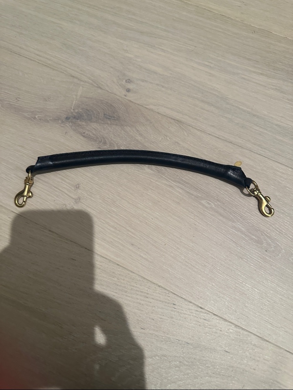 Clare v shortie tubular strap in black leather